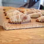 At what temperature does parchment paper ignite?