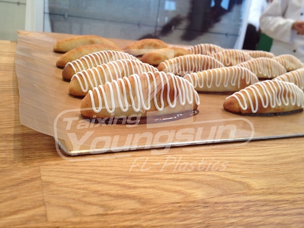 At what temperature does parchment paper ignite?