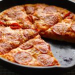 Can a cast iron skillet go in a pizza oven?