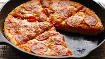 Can a cast iron skillet go in a pizza oven?