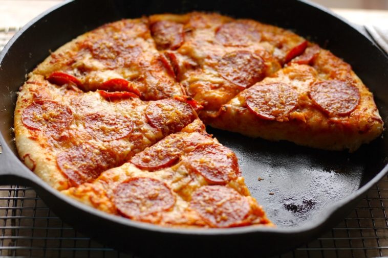 Can a cast iron skillet go in a pizza oven?