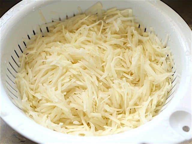Can you leave shredded potatoes in water overnight?