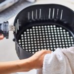 Can you put water in an air fryer to clean?