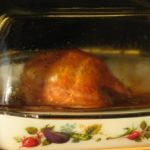 Do I put water in the bottom of a roaster for turkey?