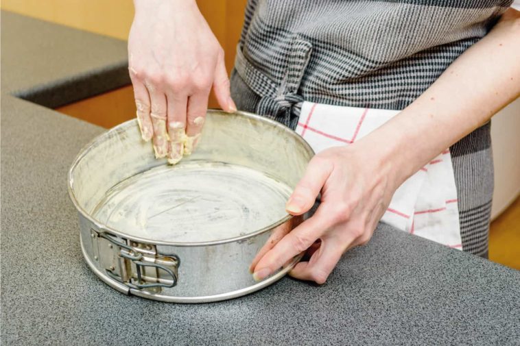 Do you grease a springform pan for cheesecake?