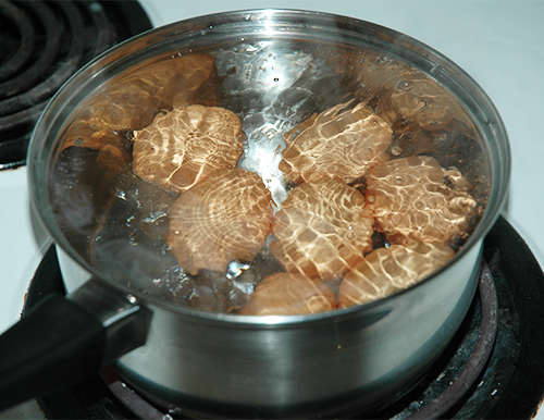 Do you put eggs in cold water after boiling?