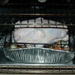 Do you put water in the pan when cooking a pork roast?