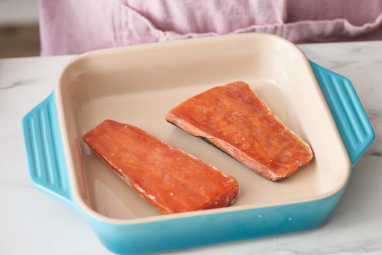 Do you wash frozen salmon before cooking?