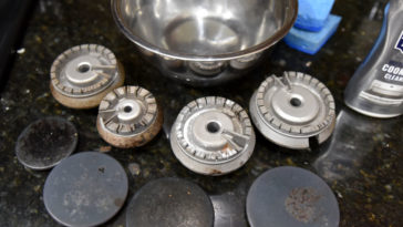 How do I clean an old gas stove burner?