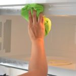How do I clean and disinfect my microwave?