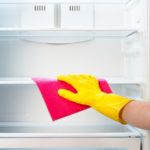 How do I clean and disinfect my refrigerator?