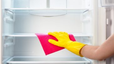 How do I clean and disinfect my refrigerator?