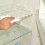 How do I clean the outside of my fridge without streaks?