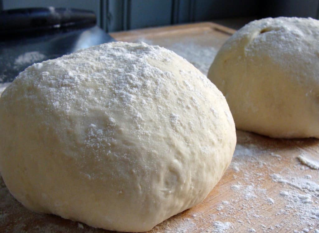 How do I cook frozen pizza dough?
