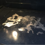 How do I get burnt stuff off the bottom of my oven?