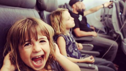 How do I keep my toddler's ears from popping on a plane?