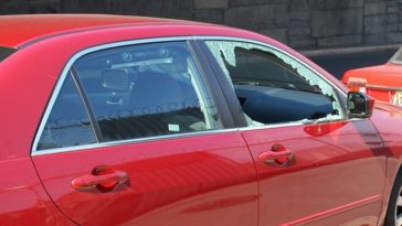 How do I temporarily cover a broken window?