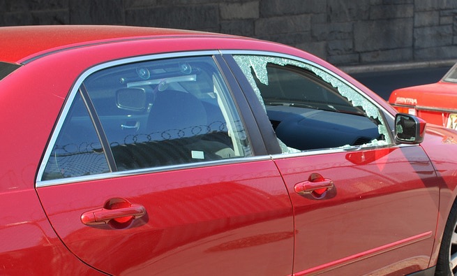 How do I temporarily cover a broken window?