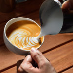 How do you add flavor to a latte?