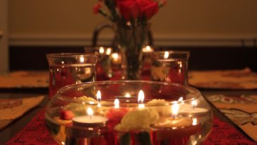 How do you arrange a romantic candle dinner at home?