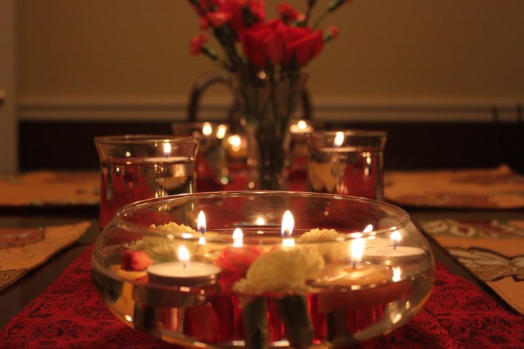 How do you arrange a romantic candle dinner at home?