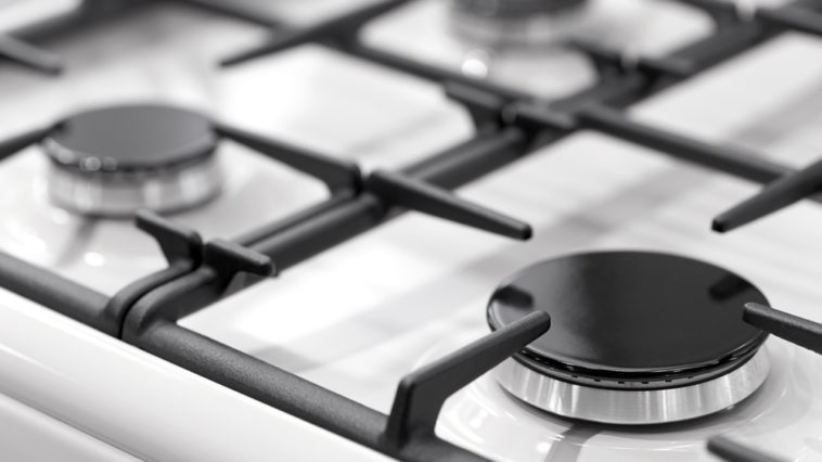 How do you clean a gas burner with vinegar?