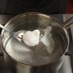 How do you crack an egg for poaching?