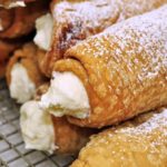 How do you eat a cannoli?