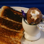 How do you eat an egg in an egg cup?