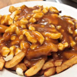 How do you eat poutine?