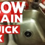 How do you fix a slow draining double kitchen sink?