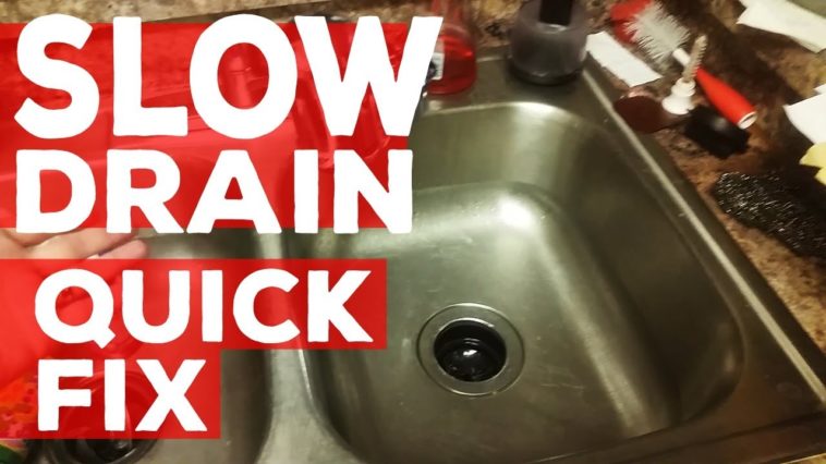 How do you fix a slow draining double kitchen sink?