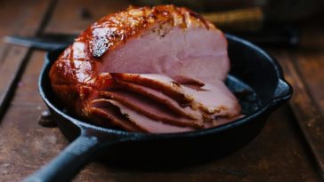 How do you heat up a precooked ham without drying it out?