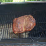 How do you keep a pork shoulder moist when smoking?