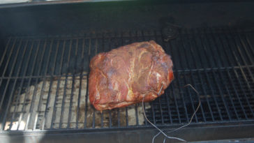 How do you keep a pork shoulder moist when smoking?
