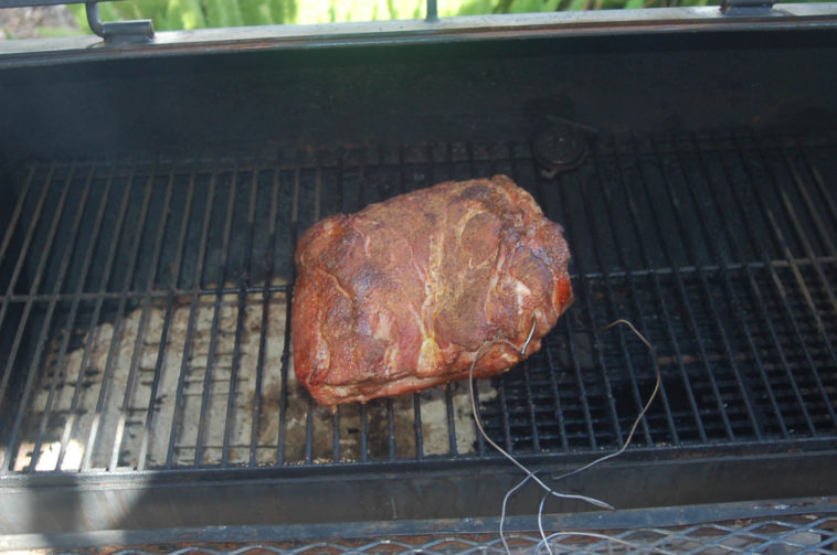 How do you keep a pork shoulder moist when smoking?