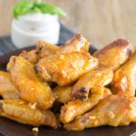 How do you keep chicken wings from drying out in the oven?