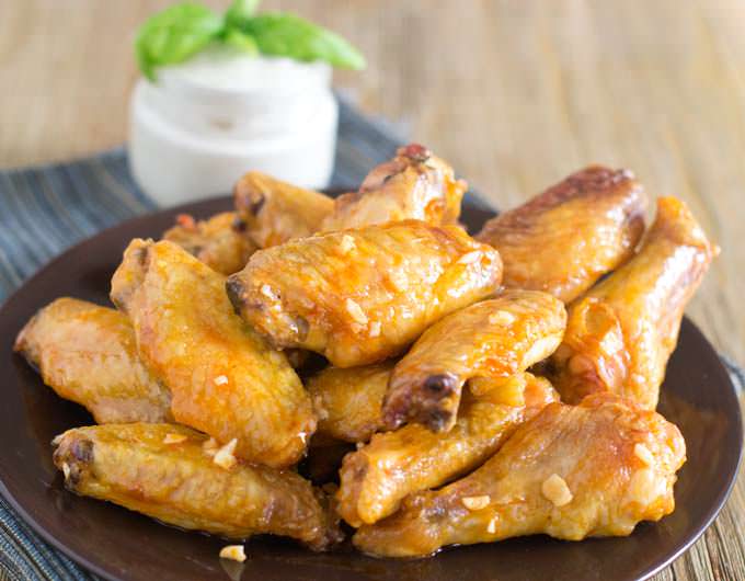 How do you keep chicken wings from drying out in the oven?