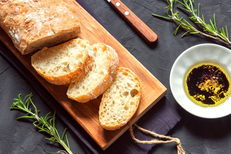 How do you reheat bread without it getting hard?