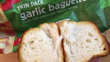 How do you reheat garlic bread without it getting hard?