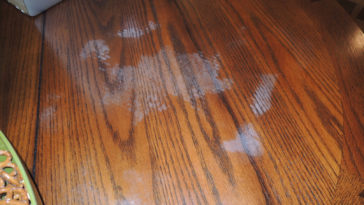 How do you remove white spots from wood tables?