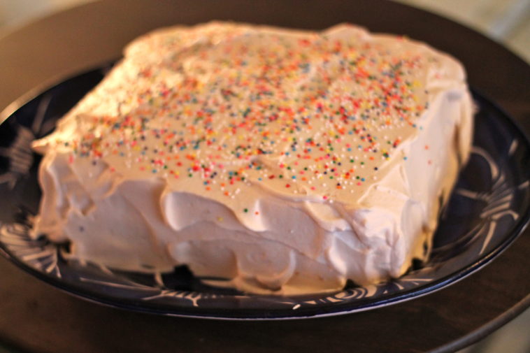 How do you store a cake with whipped cream frosting?