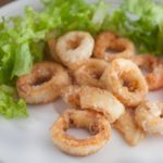 How do you tenderize calamari before frying?