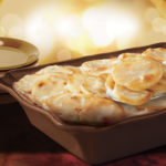 How do you warm up frozen scalloped potatoes?