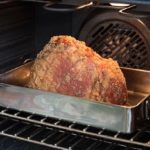 How long do you cook a precooked ham in a roaster?