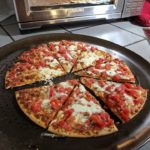 How long do you put a party pizza in the oven?