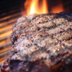 How long does it take to cook a 2 inch steak on the grill?