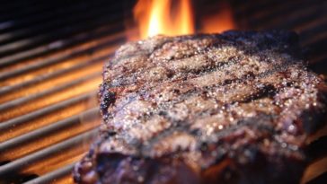 How long does it take to cook a 2 inch steak on the grill?