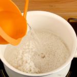 How much water do you add to 2 cups of rice?