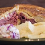 Is a Reuben made with pastrami or corned beef?
